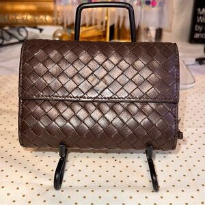 Bottega Veneta compact leather wallet.